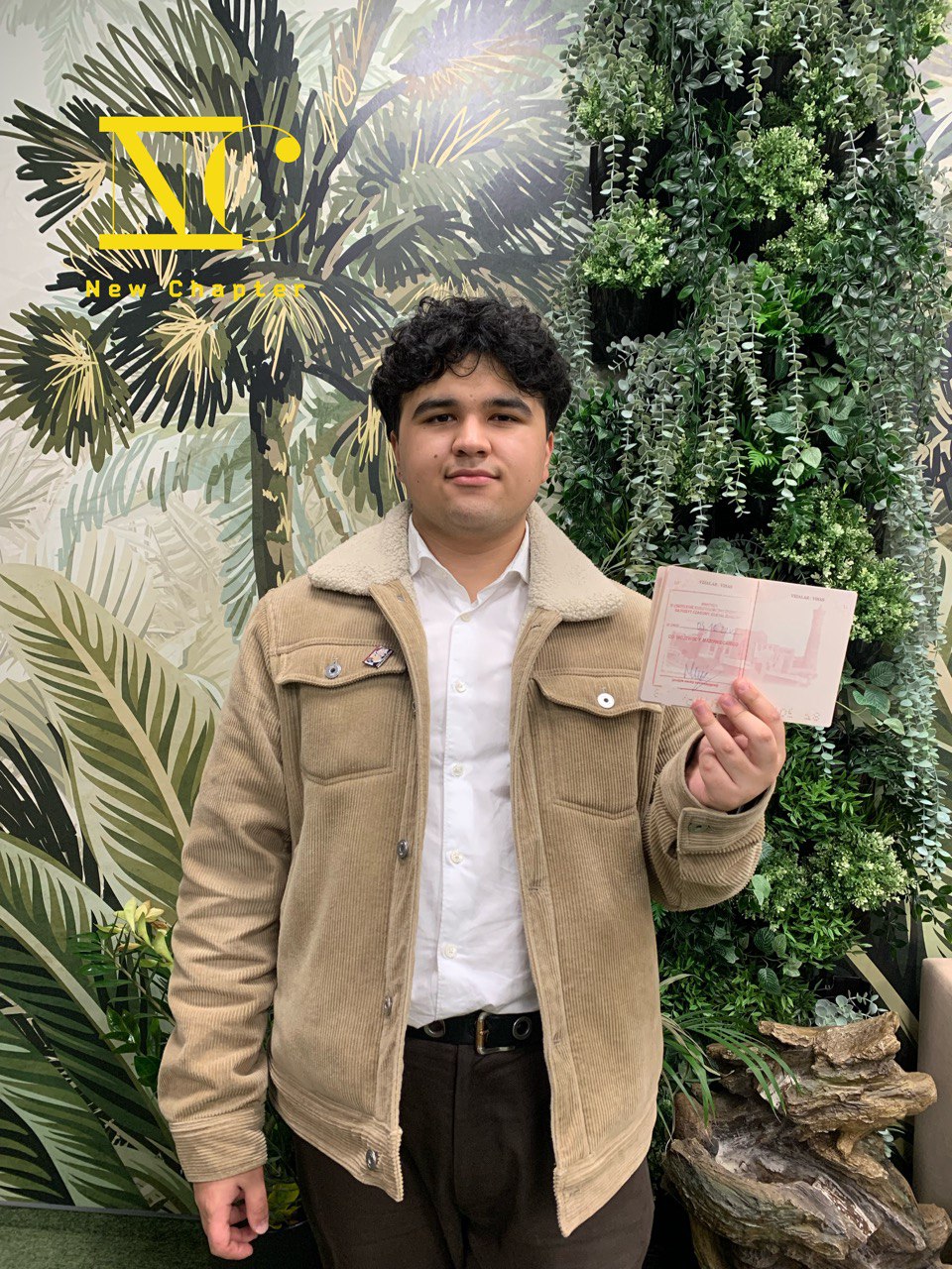 Client from Central Asia holding his Polish residence stamp