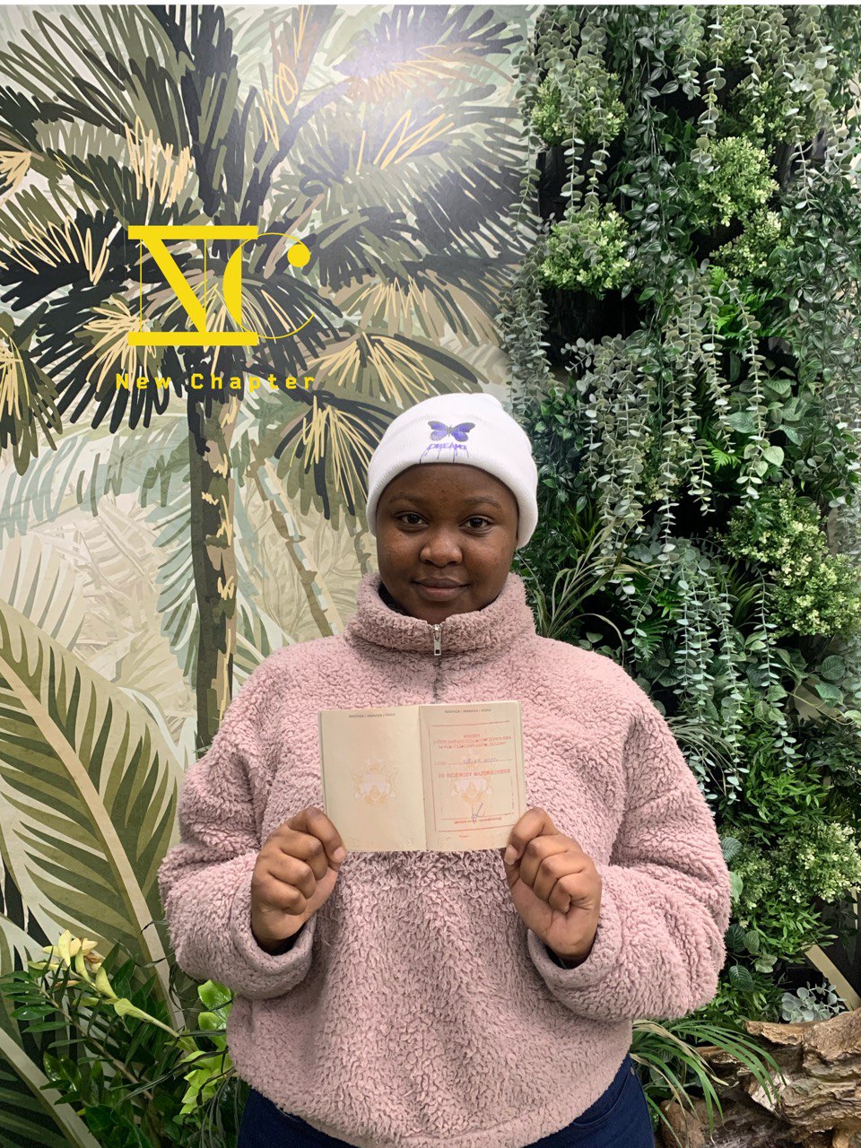 Female client from Africa holding her Polish residence document
